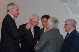 A little conspiratorial - and why is Mike scratching Chris's ear?