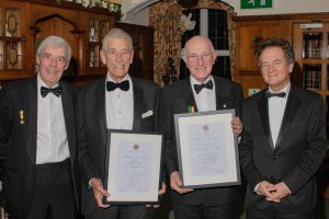 Paul and Chris proudly display their 40-year scrolls