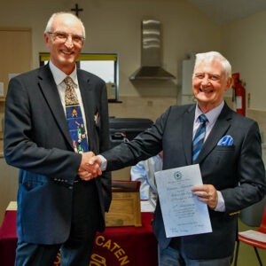 Richard receives his 40 year scroll from Mike