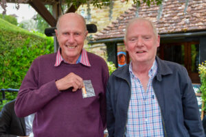 Outgoing President Pat receives his Presidential 'miniature' from new President Larry