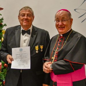 Bishop Richard presents a 40 year scroll to Richard Hawkins